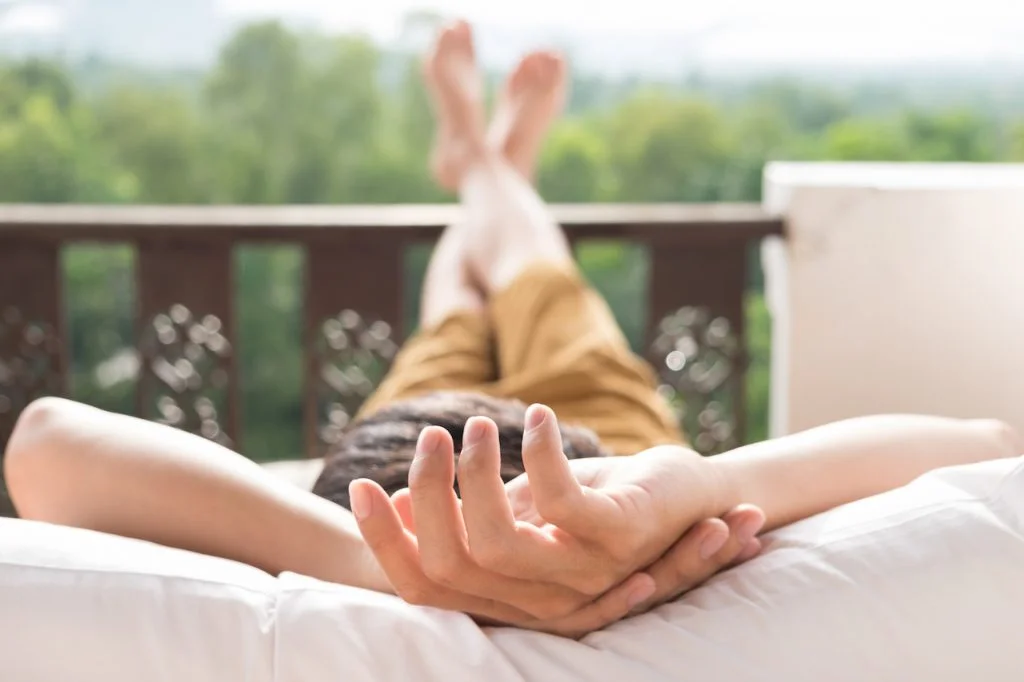 young man relax bed enjoying mountain view